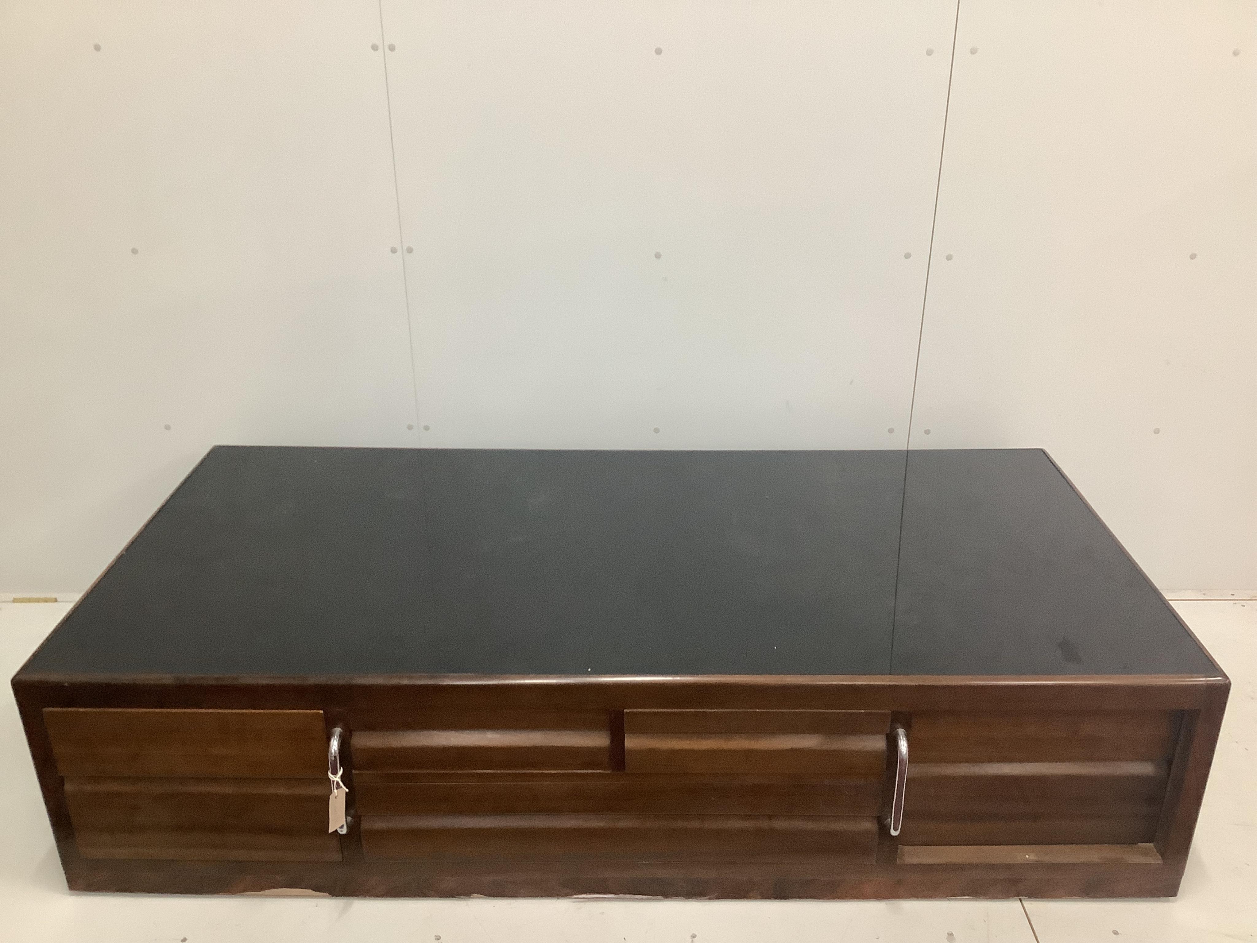 A Betty Joel satin mahogany glass top sofa table, width 196cm, depth 96cm, height 46cm. Condition - good